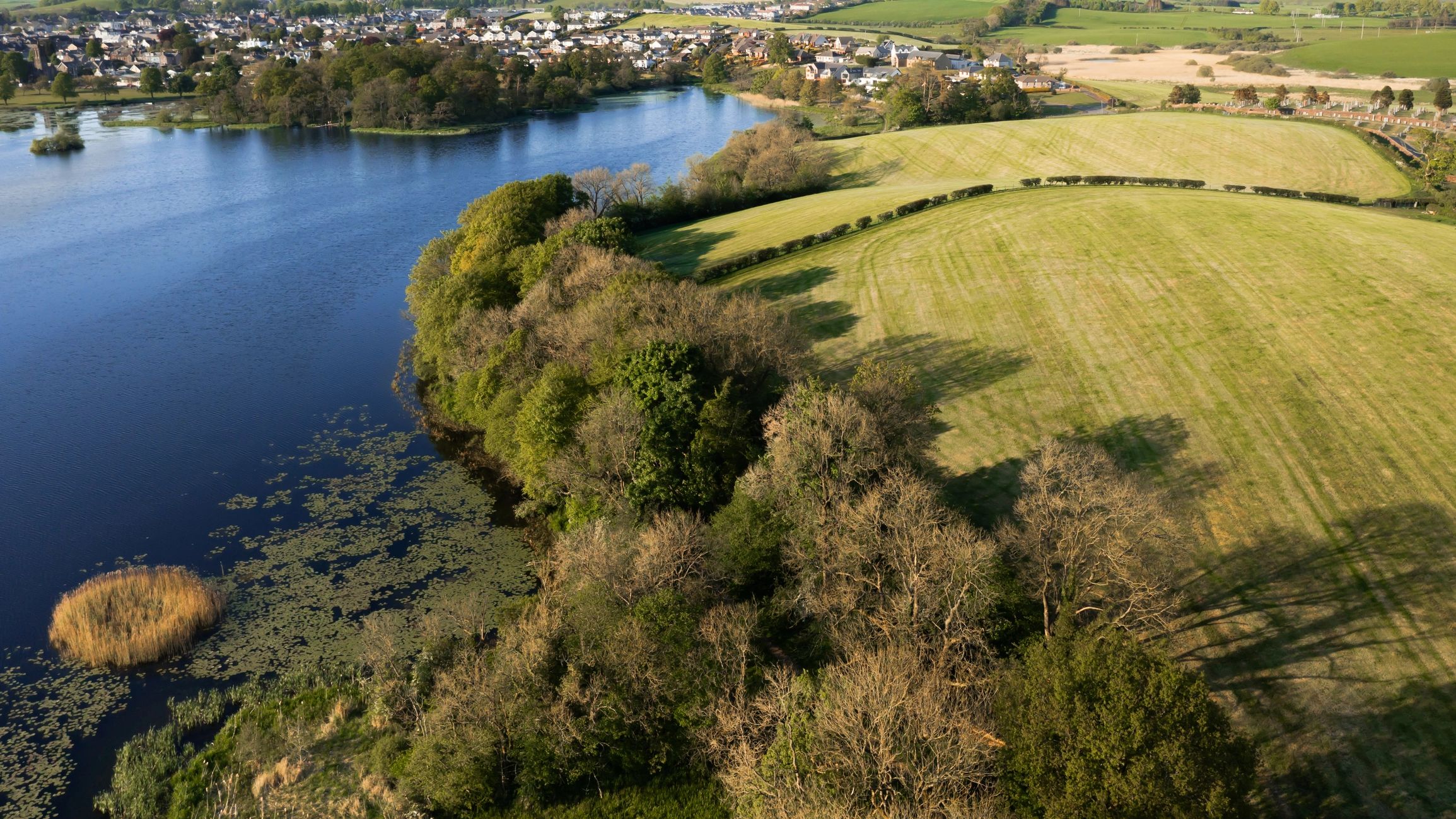 Aerial shoreline landscape representing environmental site assessment